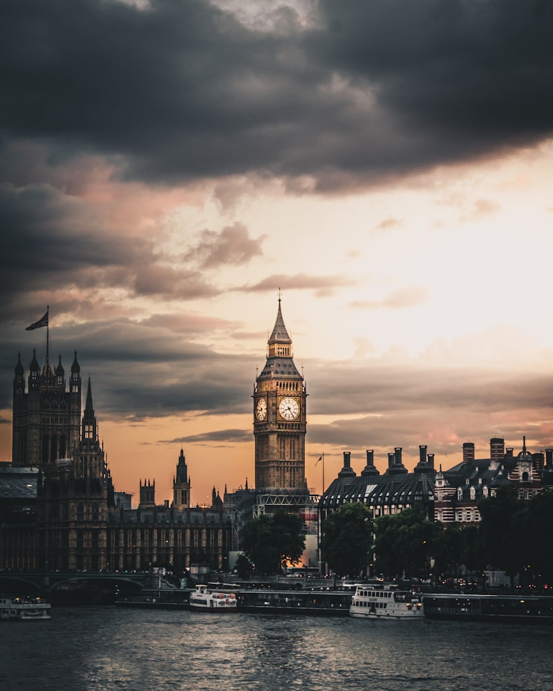 The Elizabeth Tower, known as Big Ben, and the Palace of Westminster in London, seen from the River Thames at dusk